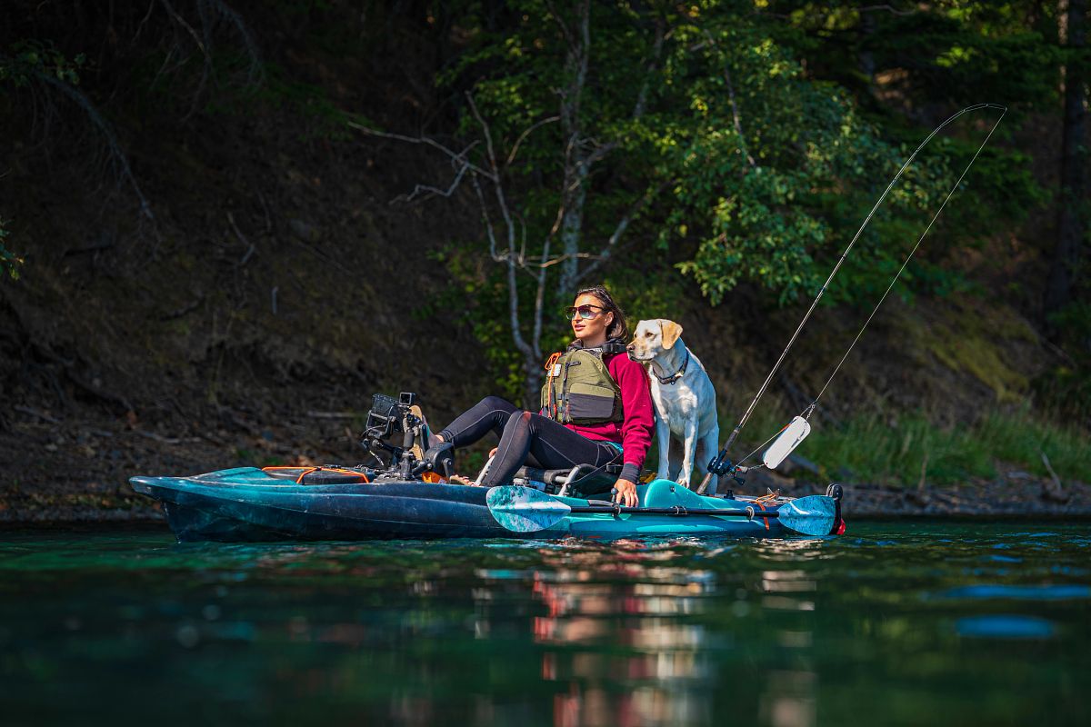 woman kayaking with dog