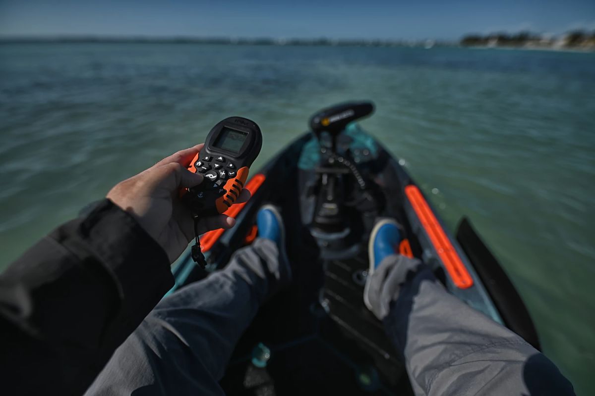 Man holding remote control on kayak